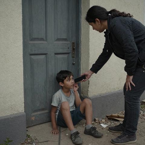 For hours, a 5-year-old sat quietly in front of a closed door, whispering to someone inside—even though the apartment had been empty for years.